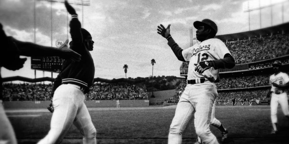 Dusty Baker and Glenn Burke exchange the first high-five at Dodger Stadium on October 2, 1977